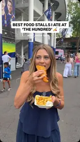 A vlog-style reel documenting a visit to 'The Hundred' cricket tournament at Lord's Cricket Ground. The creator, accompanied by her father and uncle, samples food from various stalls including fish and chips, Korean fried chicken, Greek souvlaki, and crepes, while enjoying the cricket match and atmosphere.