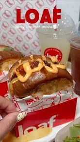 A short promotional video showcasing sandwiches and drinks from Loaf, featuring close-ups of the food and a brief appearance by the creator.