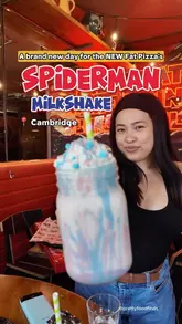 A vlog-style video showcasing a visit to The Fat Lounge in Cambridge, featuring their Spiderman milkshake, various pizzas, and a game of darts.