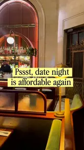 A short, atmospheric video clip showcasing the interior of a restaurant, specifically highlighting the bar area and seating, with text overlay promoting an affordable date night deal.