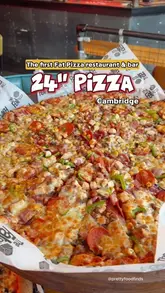 A vlog-style review of the first eat-in restaurant for The Fat Pizza in Cambridge, highlighting their massive 24-inch pizzas, sides, milkshakes, and dessert.
