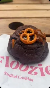 A short review video of a stuffed cookie shop in Covent Garden, London, featuring a close-up of a brownie batter cookie and a quick tour of the shop's display.