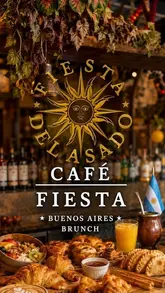 A high-quality, warm-toned promotional image for Café Fiesta, showcasing an extensive Argentinian-inspired brunch spread. The composition features a variety of pastries, breakfast dishes, and drinks arranged on a wooden table, with a bar background that adds to the atmospheric, cozy vibe.