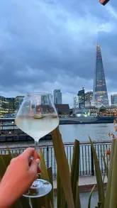 A short, aesthetic montage showcasing a dining experience at Coppa Club Tower Bridge, highlighting the riverside views, cocktails, and various dishes like tuna and burrata.