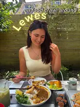A bright, outdoor shot of a person enjoying a Japanese-inspired meal, likely part of a food crawl, featuring katsu curry and sushi.