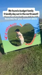 A short, handheld-style video showcasing a family-friendly farm visit, featuring a child interacting with animals and playing on a playground.