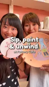 A vlog-style video showcasing a visit to a pottery cafe, featuring the painting process, the venue's atmosphere, and food/drink options like vegan banana bread and coconut matcha latte.