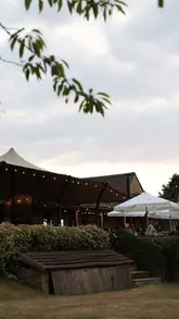 A montage showcasing a summer evening at a country inn in the Cotswolds, featuring outdoor dining, cocktails, grilled dishes, and scenic views.