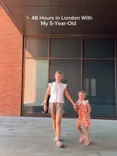 A bright, high-quality still from a travel reel showcasing a family-friendly itinerary in London, featuring a mother and child walking together.