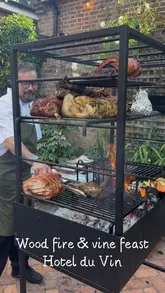 A video showcasing a 'Wood-Fire & Vine Feast' event at Hotel du Vin, featuring an outdoor courtyard setting, grilled meats, antipasti, and dessert.