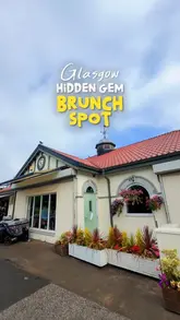 A creator visits The Boathouse in Rouken Glen Park, Glasgow, providing a tour of the waterside location and reviewing their brunch menu, including pancakes, Cobb salad, and Korean chicken French toast.