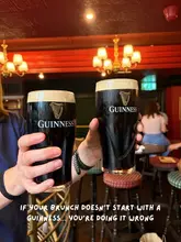 A promotional social media image featuring two pints of Guinness being toasted in a pub setting, used to advertise a bottomless brunch.