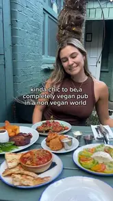 A short montage showcasing a variety of vegan dishes at a pub, including starters, mains, and desserts.