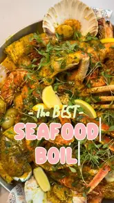 A creator reviews a seafood boil experience at Rock & Scallop, showcasing various dishes including lobster, crab, prawns, calamari, and surf and turf. The video features the creator eating the food, highlighting the quality and flavour of the seafood and sides.