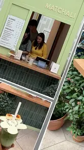 A short, fast-paced reel showcasing a matcha pop-up stand in London, highlighting the preparation process of a banana iced matcha latte.