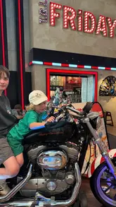 A relatable parenting-focused reel showing a family visiting TGI Fridays to take advantage of a 'kids eat free' promotion, using the restaurant as a solution to chaotic home life.