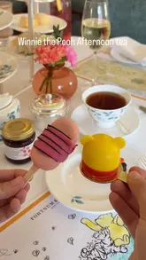 A visually appealing montage showcasing the Winnie the Pooh themed afternoon tea at Fortnum & Mason, highlighting the themed pastries, tea service, and associated merchandise.