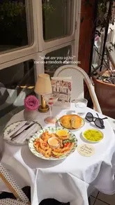 A short, aesthetic montage showcasing the dining experience at a restaurant in Mayfair, featuring cocktails, fried seafood, dessert, and live piano music on a terrace.