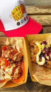 A montage video capturing the atmosphere and food offerings at WingFest, featuring various wing vendors, live music, and festival activities like a mechanical bull and dunk tank.