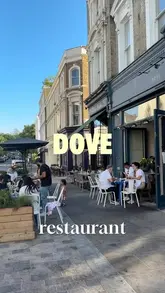 A vlog-style review of a restaurant called Dove in Notting Hill, featuring the creator trying various dishes including tuna tostada, prawns, focaccia, sirloin steak, and a tomato salad.
