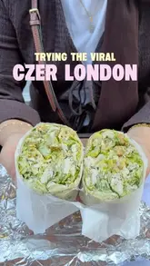 A vlog-style review of a viral salad wrap spot in Mayfair, London, showing the queue, the preparation process, and the creator's reaction to the food.
