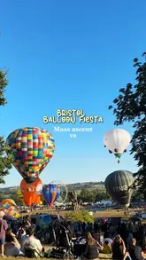 A montage video capturing the Bristol Balloon Fiesta, featuring the mass ascent of various hot air balloons during the day and the night glow event. The video also briefly highlights festival food options like chicken and chips and ice cream.