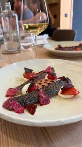A review of the tasting menu experience at Fallachan Kitchen in Glasgow, highlighting the open kitchen concept, the quality of the food, and the wine pairing service.