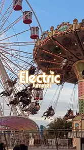 A montage video showcasing the Electric Summer pop-up event at Battersea Power Station, featuring fairground rides like a Ferris wheel and bumper cars, giant chess, food trucks, and a bar area.