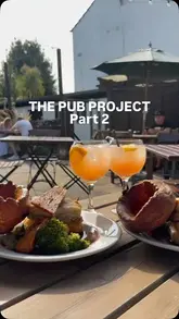 A short, handheld-style video review of a Sunday roast at The Windsor Castle in North London, featuring shots of the pub exterior, the roast dinner, drinks, and the outdoor seating area.