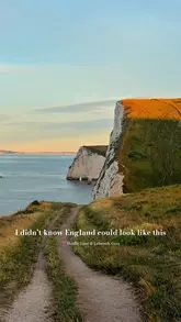 A cinematic montage of Durdle Door and Lulworth Cove in Dorset, featuring sweeping drone shots and stable handheld footage that highlights the dramatic coastline and turquoise waters.