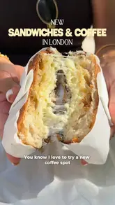 A short, engaging vlog-style reel showcasing a visit to Mardy's in Mayfair. The video highlights the menu, the coffee-making process, and the sandwiches, specifically focusing on the cheese-filled toasties and the outdoor courtyard seating area.