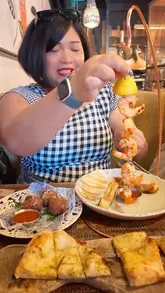 A creator visits a Zizzi restaurant, showcasing a variety of menu items including cocktails, appetizers, pizza, pasta, and desserts, while recommending it for various social occasions.