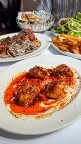 A creator visits Kismet, a Turkish-Cypriot Meyhane in Borough Market, showcasing the interior, the open-fire cooking, and a variety of dishes including mezze, monkfish kebab, lamb neck, and dessert.