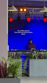 A montage video showcasing a rooftop venue in Newcastle, featuring various food dishes like tacos, nachos, arancini, and meatballs, alongside cocktails and a lively atmosphere with a DJ.