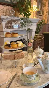 A visually appealing, slow-paced reel showcasing an afternoon tea service at The Royal Horseguards Hotel. The video features shots of the hotel exterior, the elegant interior, the table setting, and close-ups of the sandwiches, scones, and pastries, set to relaxing music.