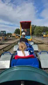A family day out vlog at Diggerland, showcasing various digger-themed rides and activities suitable for young children.