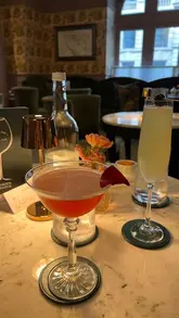 A short, aesthetic montage showcasing the interior, cocktails, and small plates at The Green Parlour within The Royal Horseguards Hotel, emphasizing a relaxed, upscale date night atmosphere.