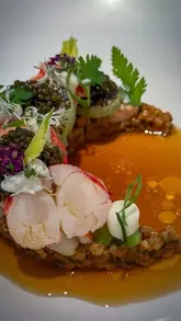 A high-quality, visually focused reel showcasing a series of exquisite dishes from Core by Clare Smyth, a Michelin-starred restaurant in Notting Hill. The video highlights the intricate plating and artistic presentation of the tasting menu.