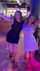 A group of friends documents their day out in Bath, starting with drinks on the train, walking through a decorated street, playing shuffleboard at a venue, and enjoying cocktails at an outdoor table.