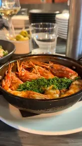 A visually appealing reel showcasing a tasting menu experience at Salt Yard Borough, featuring close-ups of various dishes and the open kitchen environment.
