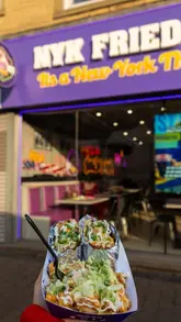 A fast-paced, handheld-style video showcasing a variety of fried chicken sandwiches, burgers, loaded fries, and milkshakes at NYK Fried Chicken, highlighting the crispy texture and flavourful presentation.