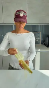 A home cooking tutorial demonstrating how to prepare a peri peri steak and charred corn salad.