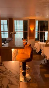 A short, cinematic montage showcasing the interior, table settings, and various dishes at Latine Mayfair. The video focuses on the elegant atmosphere and high-quality food presentation, using smooth camera movements and transitions to create a sophisticated vibe.
