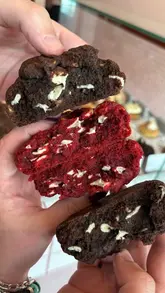 A short promotional video showcasing a visit to the cookie and doughnut shop 'Gooey' at Meadowhall. The video features close-up shots of various cookies and doughnuts, a look at the menu, and the preparation of drinks, ending with a satisfying pull-apart shot of the cookies.