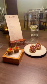 A montage of high-quality, close-up shots featuring a 10-course tasting menu at Faru in Durham. The video highlights the presentation and detail of various dishes, including sea bass and hen of the woods, set to music with minimal text overlays.