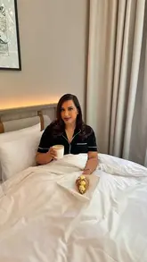 A short promotional video for The Drey Hotel, featuring a tour of the hotel room, bathroom, and exterior, along with a breakfast scene. The video is presented as a giveaway post.
