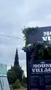 A montage video showcasing The Mound Village at the Edinburgh Fringe, featuring live music, street food vendors, cocktails, and the overall festival atmosphere.