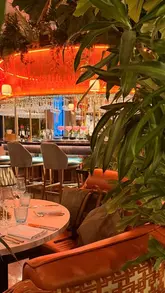 A montage showcasing the interior, cocktails, and dishes at Idalia restaurant in London, highlighting the atmosphere and dining experience.