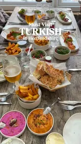 A montage of various Turkish dishes including mezze, kebabs, and a birthday dessert, filmed at Skewd restaurant in The Grove Hotel.