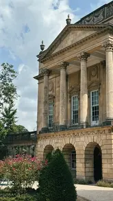 A travel guide video showcasing various summer activities in Bath, including museum visits, an open-top bus tour, shopping, a spa treatment, and cocktails.